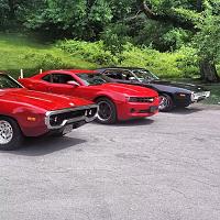 Three generations of Gregory Thomas's. From left to right: Sr., III, Jr. 
 
Two 1972 Plymouth Satellites and my 2012 Camaro