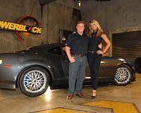 John Hennessey and Courtney Hansen with the HPE1000 Twin Turbo Camaro on the set of POWERBLOCK TV.