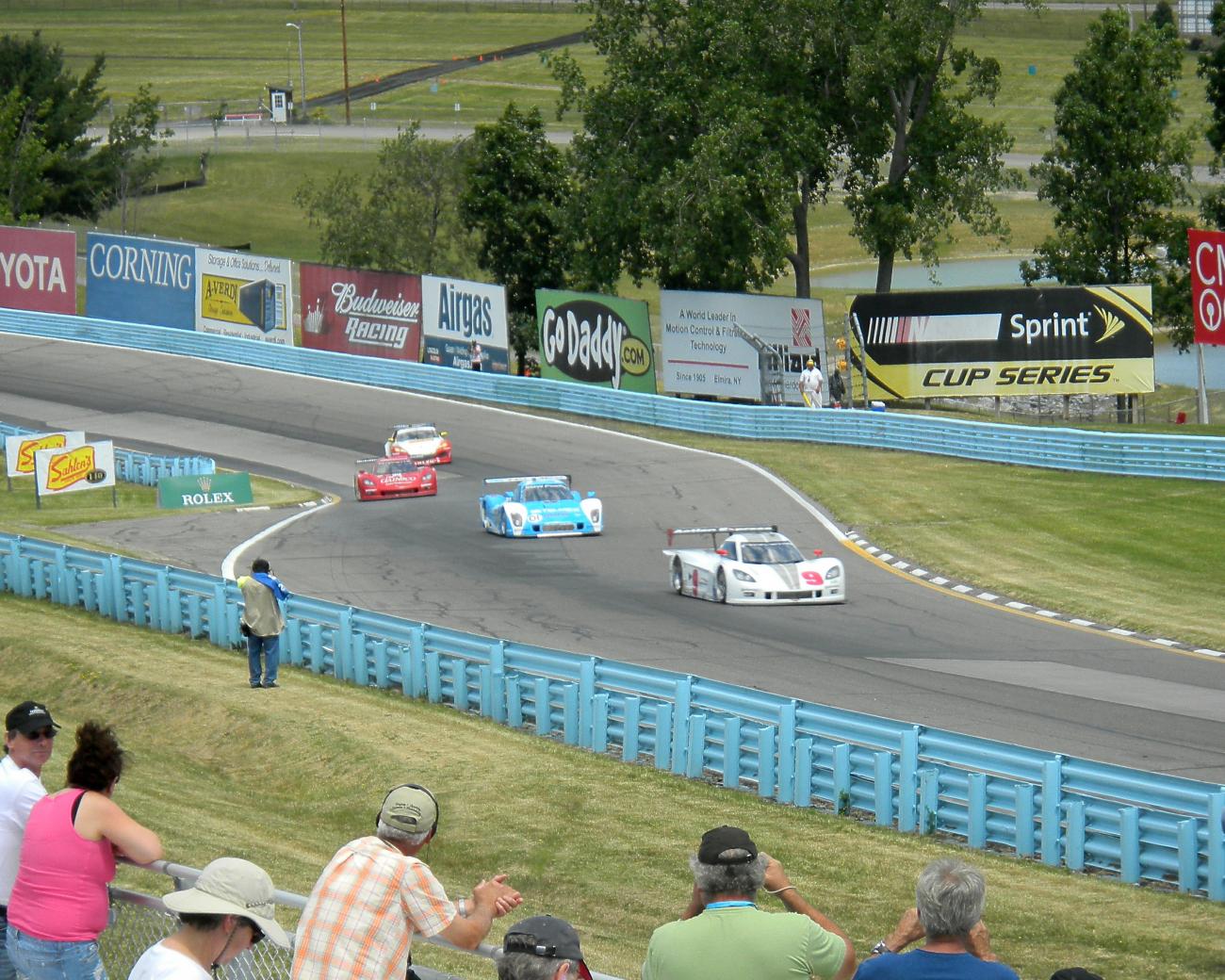 BMW sandwiched by two Corvettes.