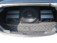 Trunk showing 2 Amps & 12" Subwoofer - rear facing.