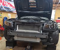 Front cover removed and Z/28 splitter upper brackets installed. Also removed tint on the headlights and polished.