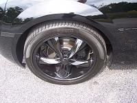Foose wheels. Outer lip and center cap painted black. Black painted brake caliper covers.