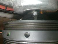 The trick is to get the jaws of 3 jaw puller on the grooves in back of the stock pulley.