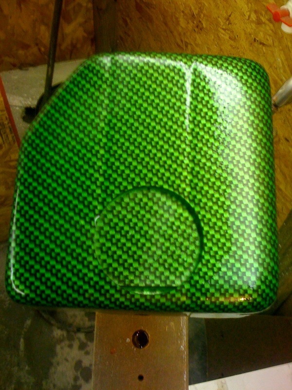 this is a new custom piece from RPI designs in OH. i am a lauch customer for synergy green hydro carbon pieces..this will be for the stock common clutch/brake fluid rez note the hole that still needs to be cut out...coming friday!!! this will look really good, and go well with the seat inserts...